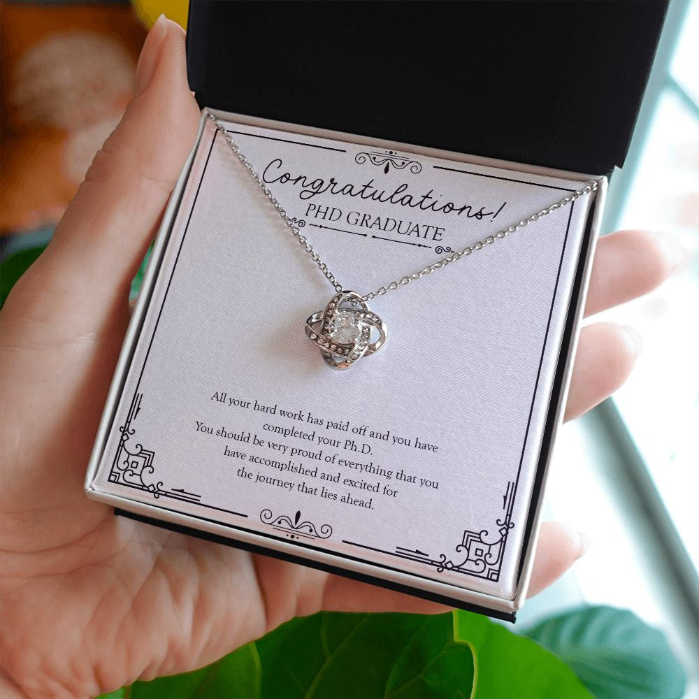 Hard Work Has Paid Off love knot necklace in hand