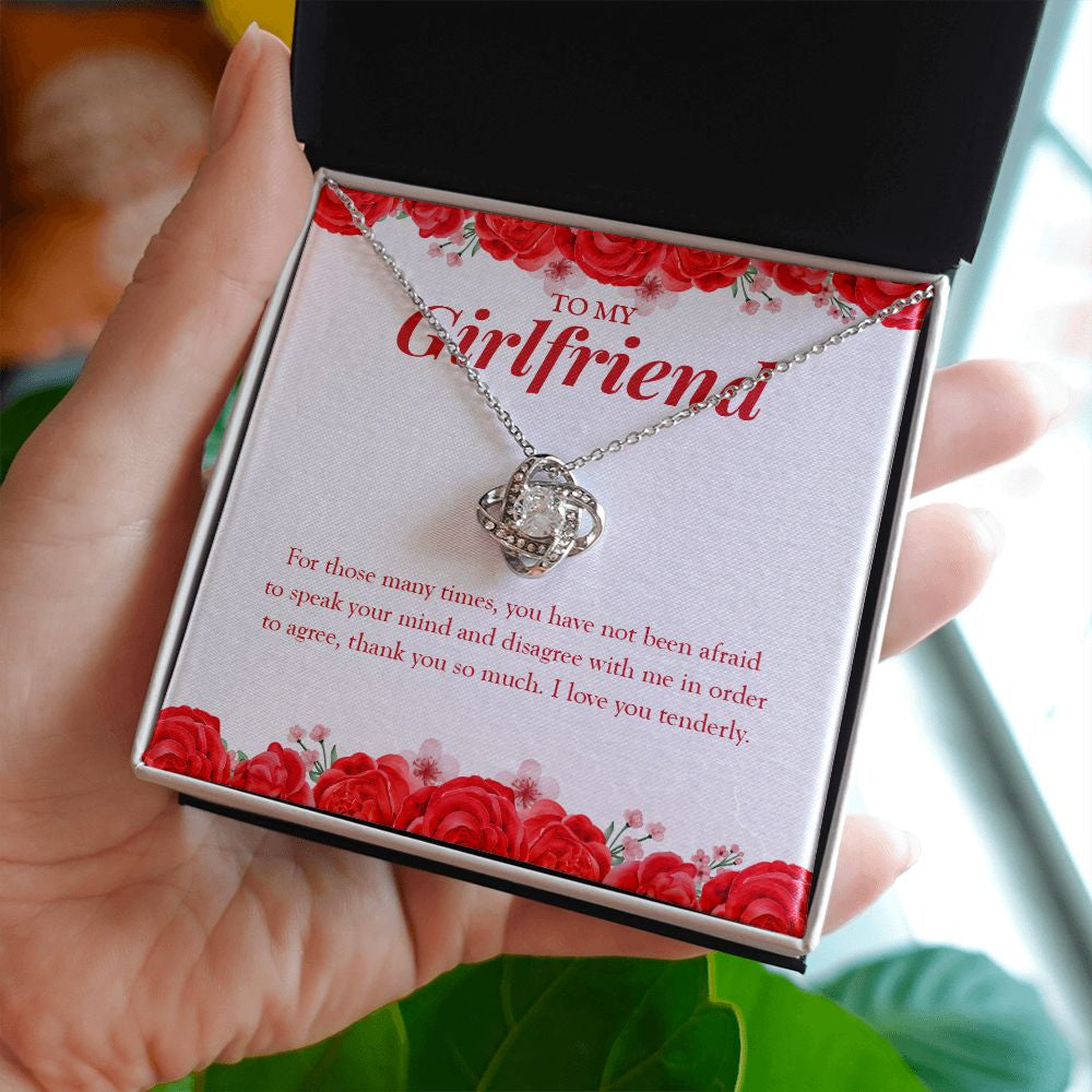 Not Afraid To Speak Your Mind love knot necklace in hand