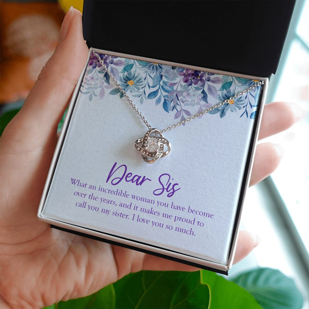 What An Incredible Woman love knot necklace in hand