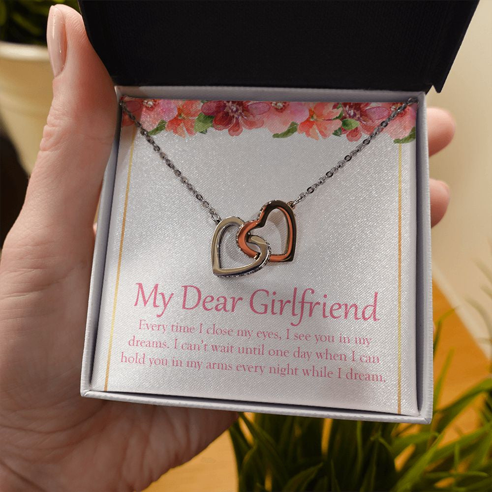 I See You In My Dreams interlocking heart necklace in hand