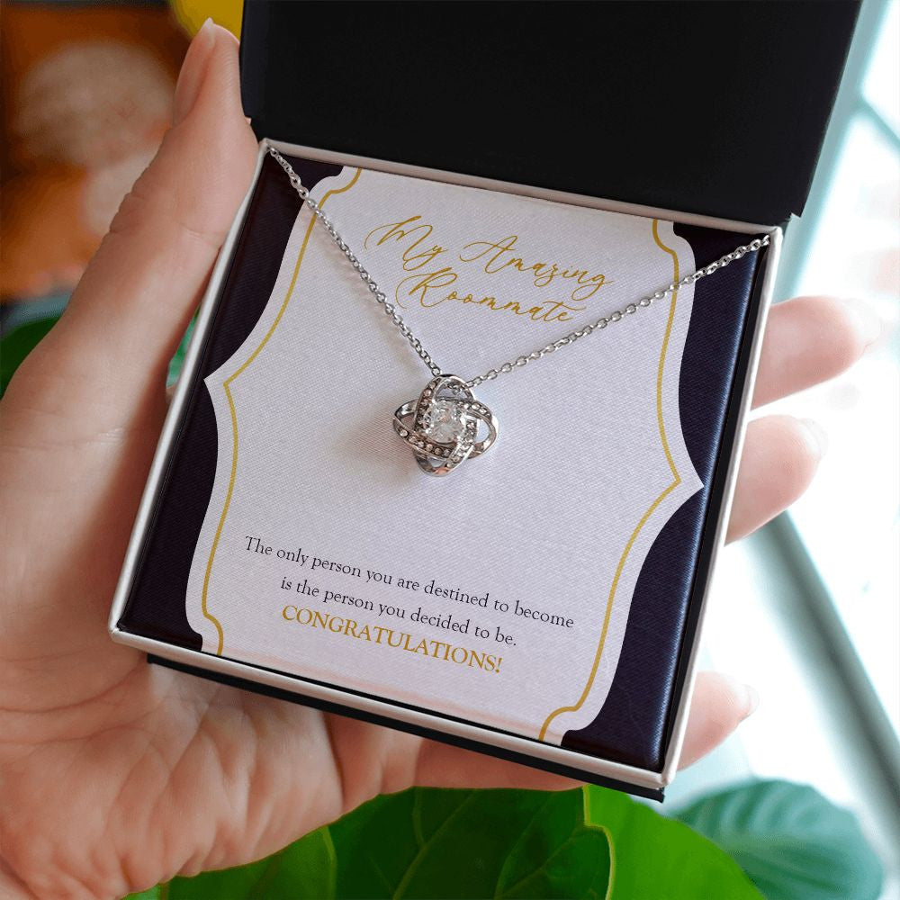 The Person You are Destined To Become love knot necklace in hand