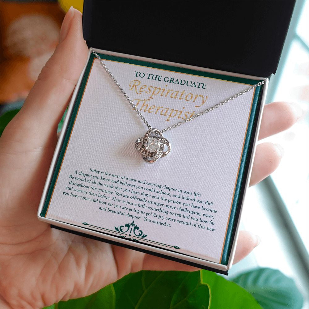 You Earned It love knot necklace in hand