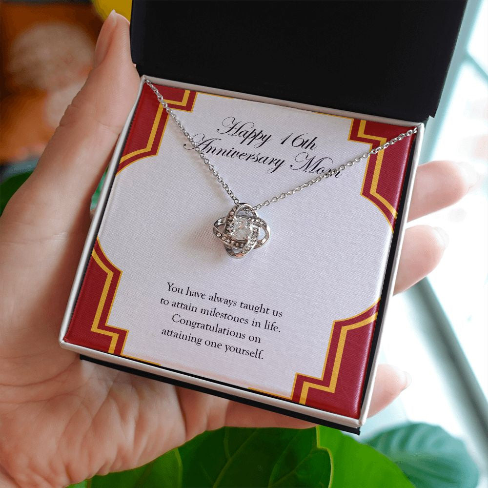 Attaining One Yourself love knot necklace in hand