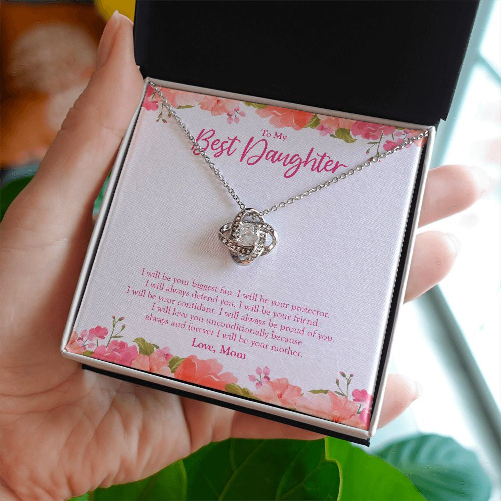 Your Biggest Fan love knot necklace in hand