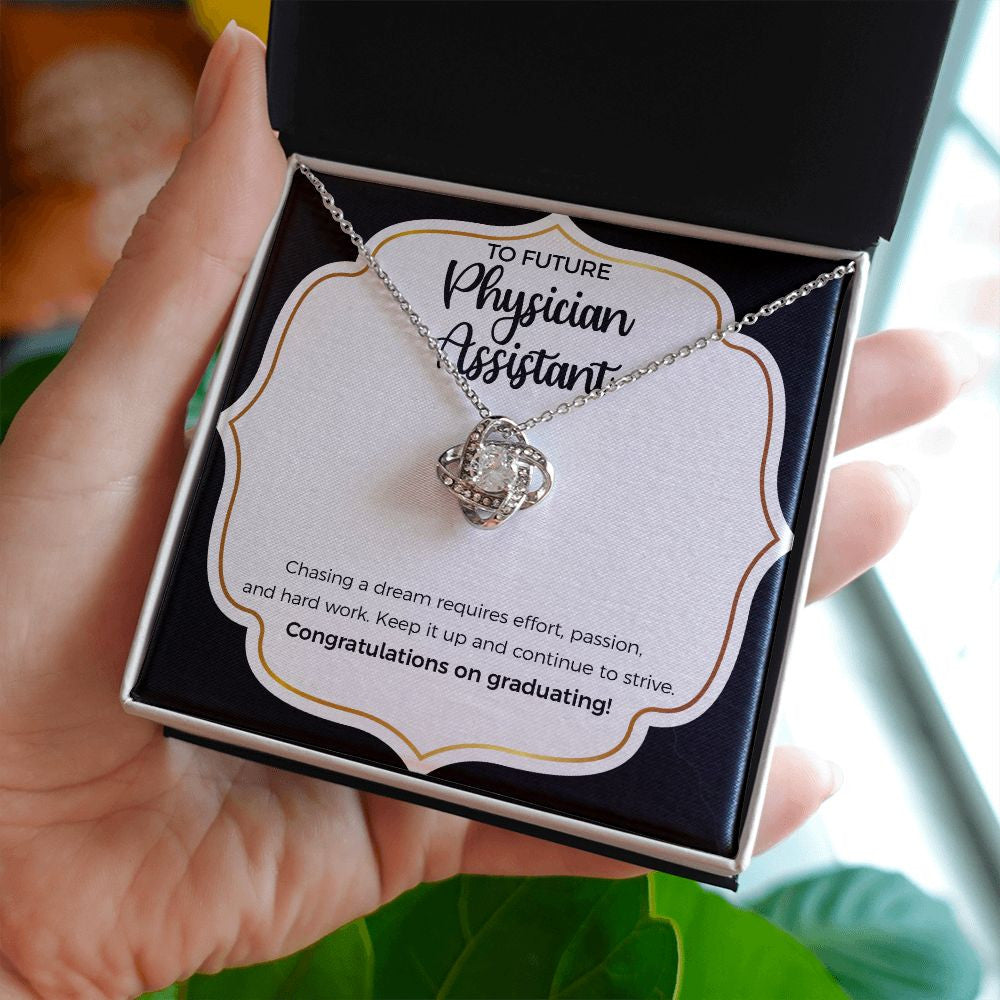 Keep It Up love knot necklace in hand