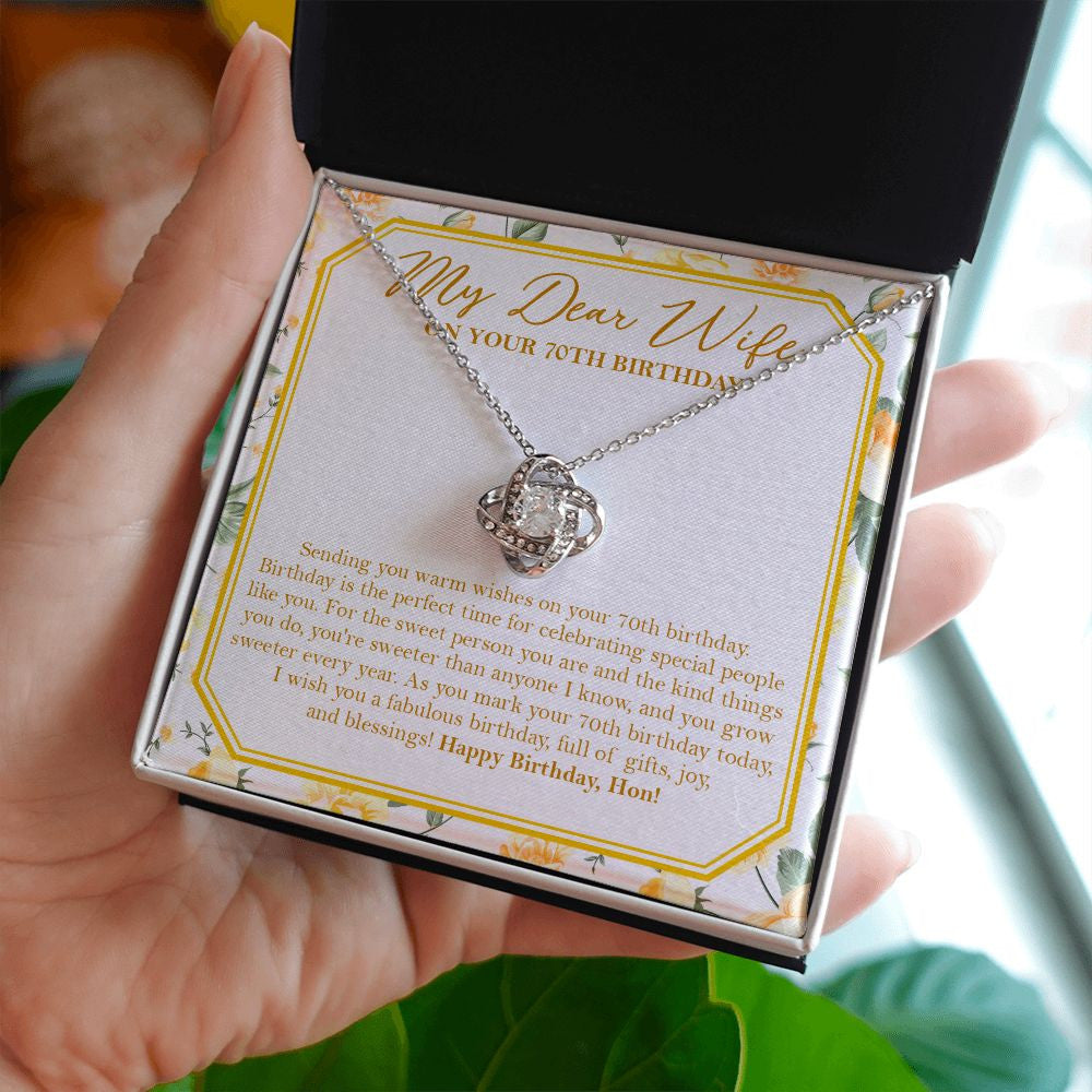 Sweet Person You Are love knot necklace in hand