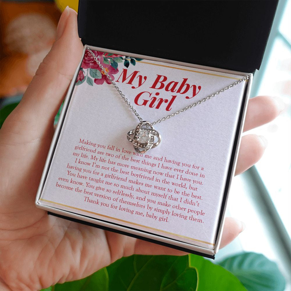 Life Has More Meaning With You love knot necklace in hand