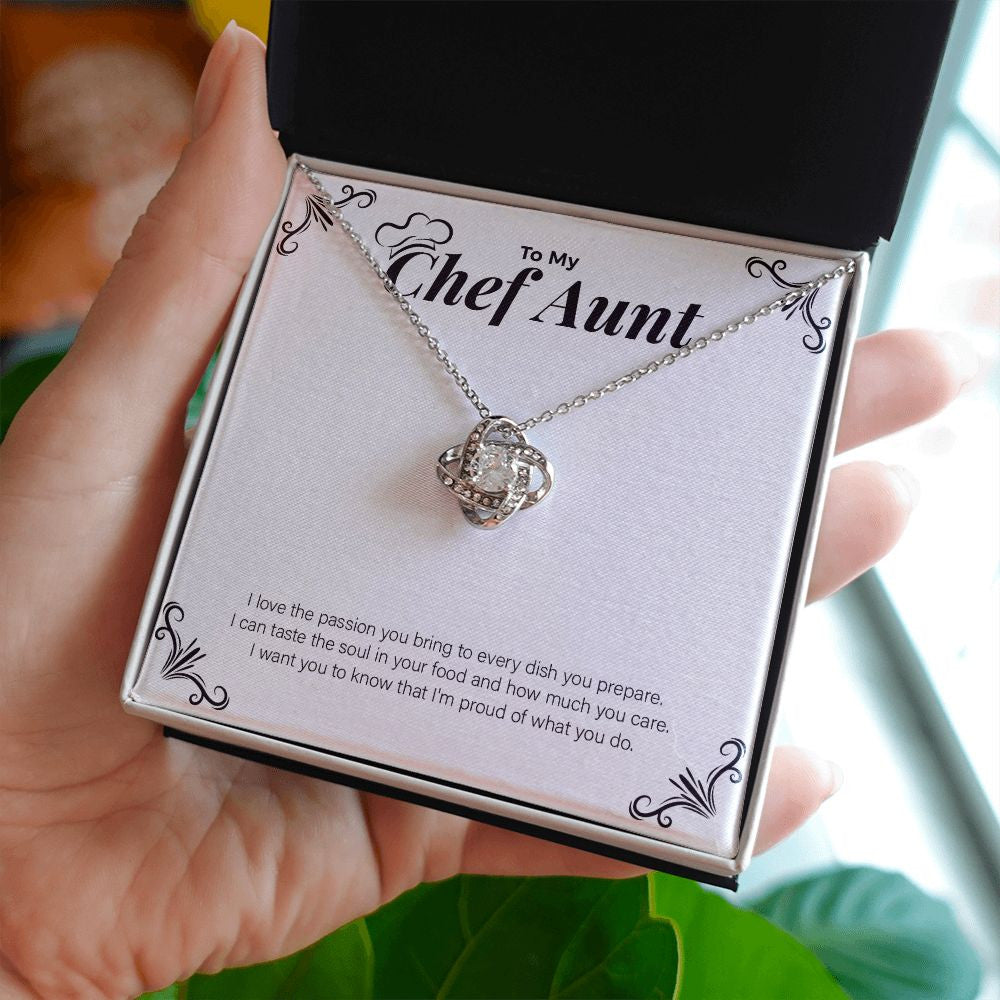 Passion To Every Dish love knot necklace in hand
