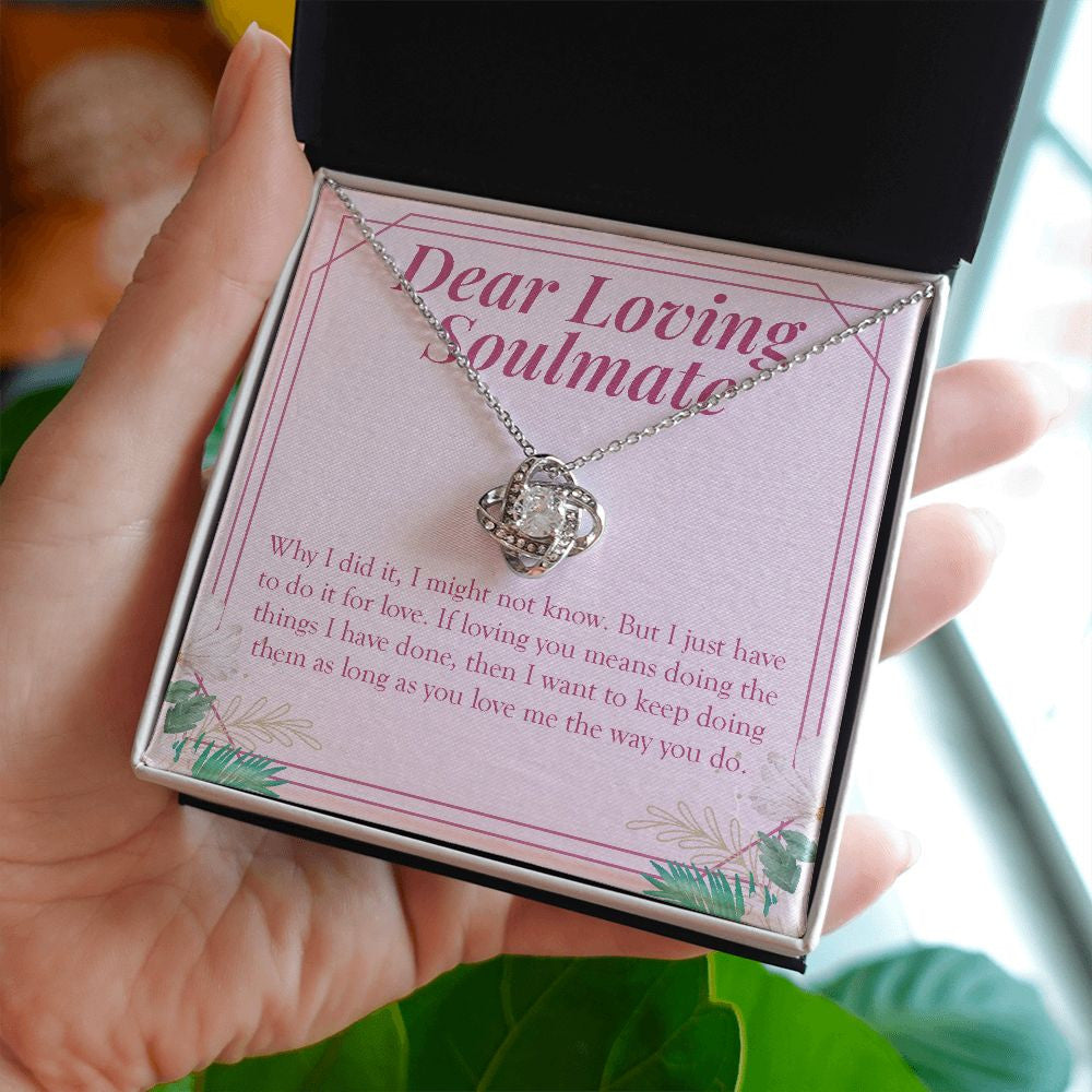 Do It For Love love knot necklace in hand