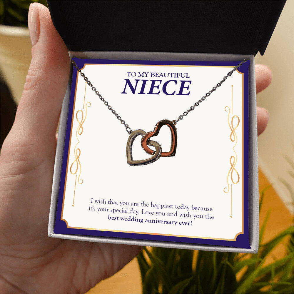 The Happiest Today interlocking heart necklace in hand