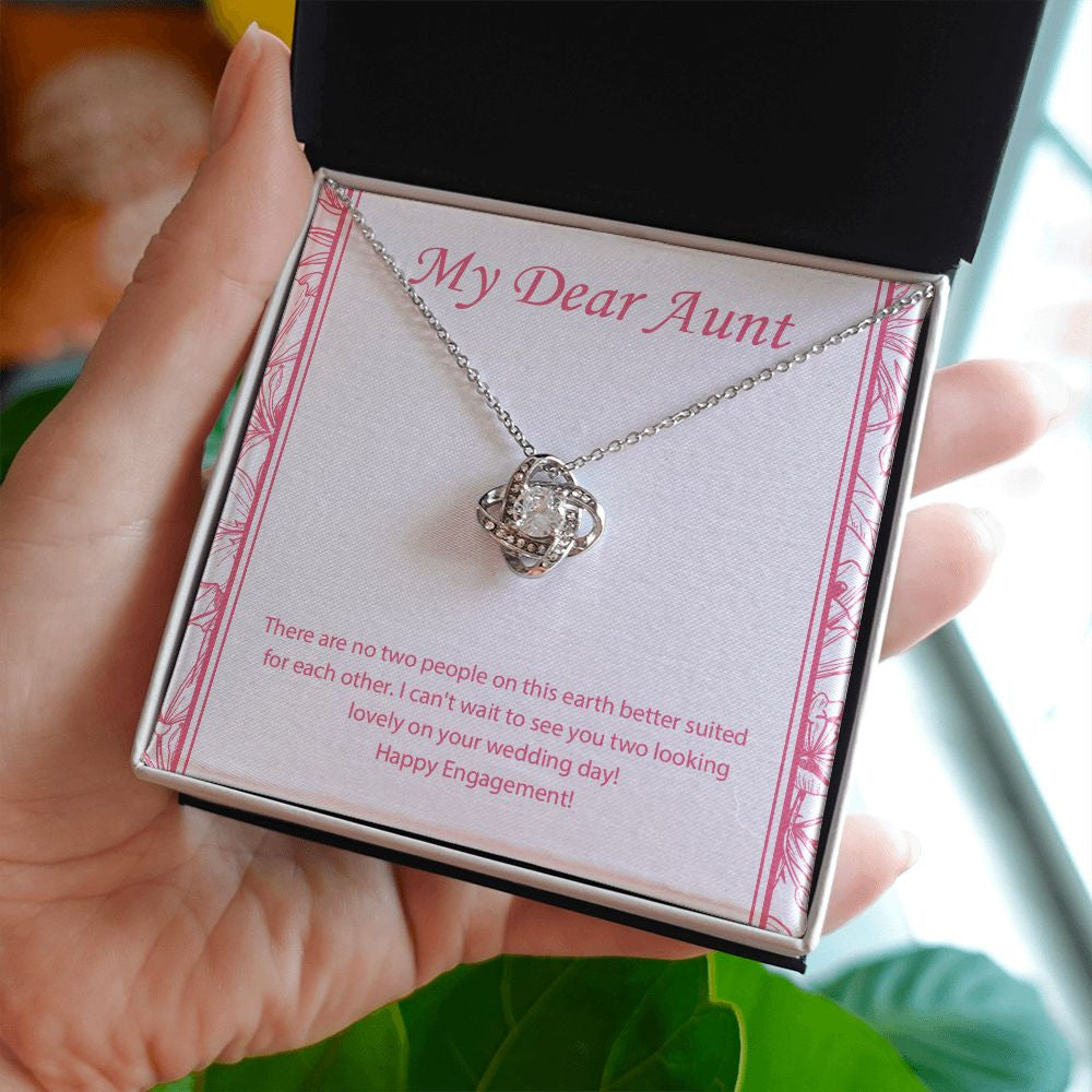 No Two People love knot necklace in hand