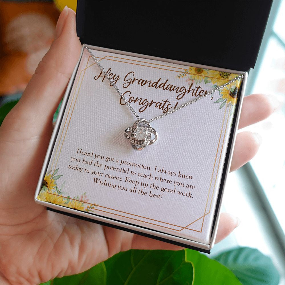 Keep Up The Good Work love knot necklace in hand