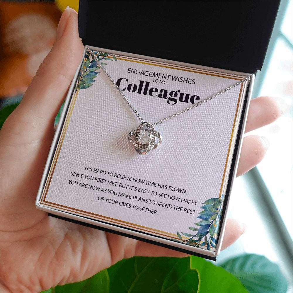 Hard To Believe love knot necklace in hand