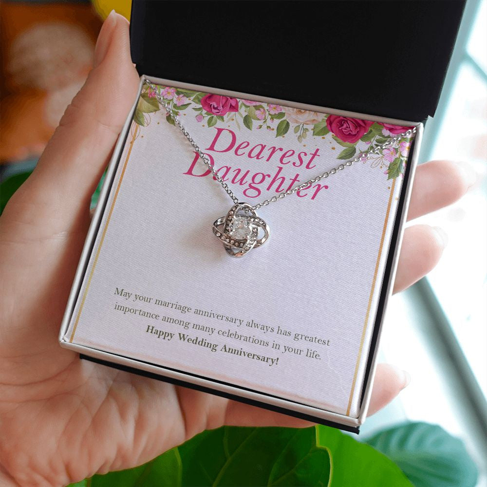 Always Has Greatest Importance love knot necklace in hand