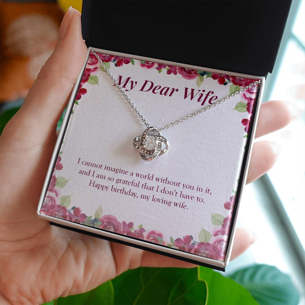 So Grateful To You love knot necklace in hand