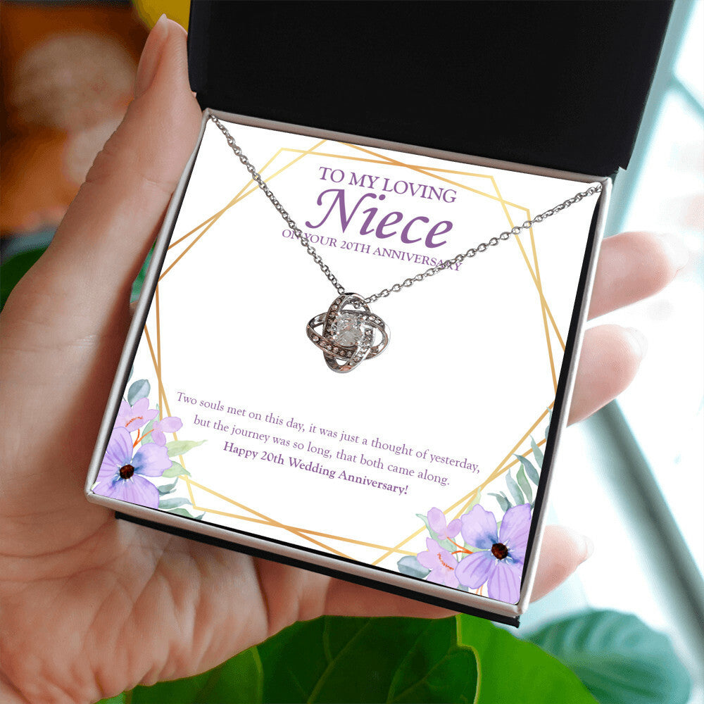 Two Soul Met This Day love knot necklace in hand