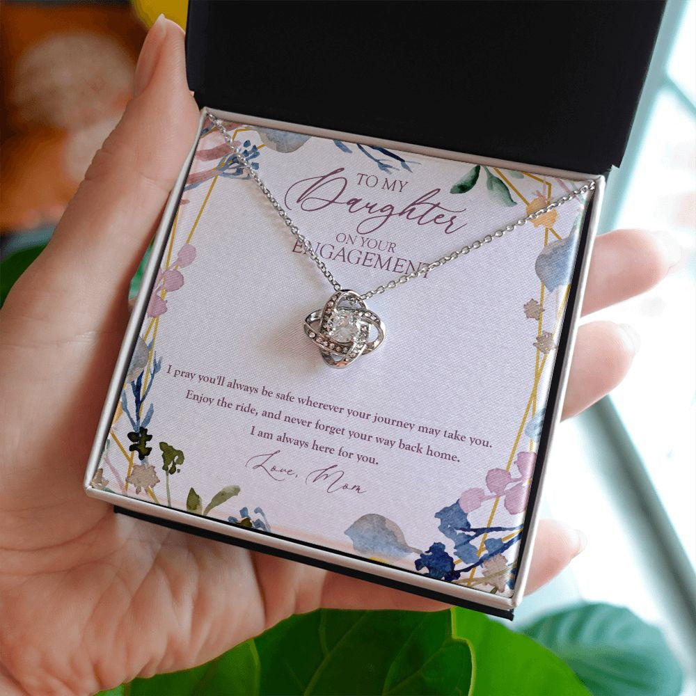 Wherever Your Journey Take You love knot necklace in hand