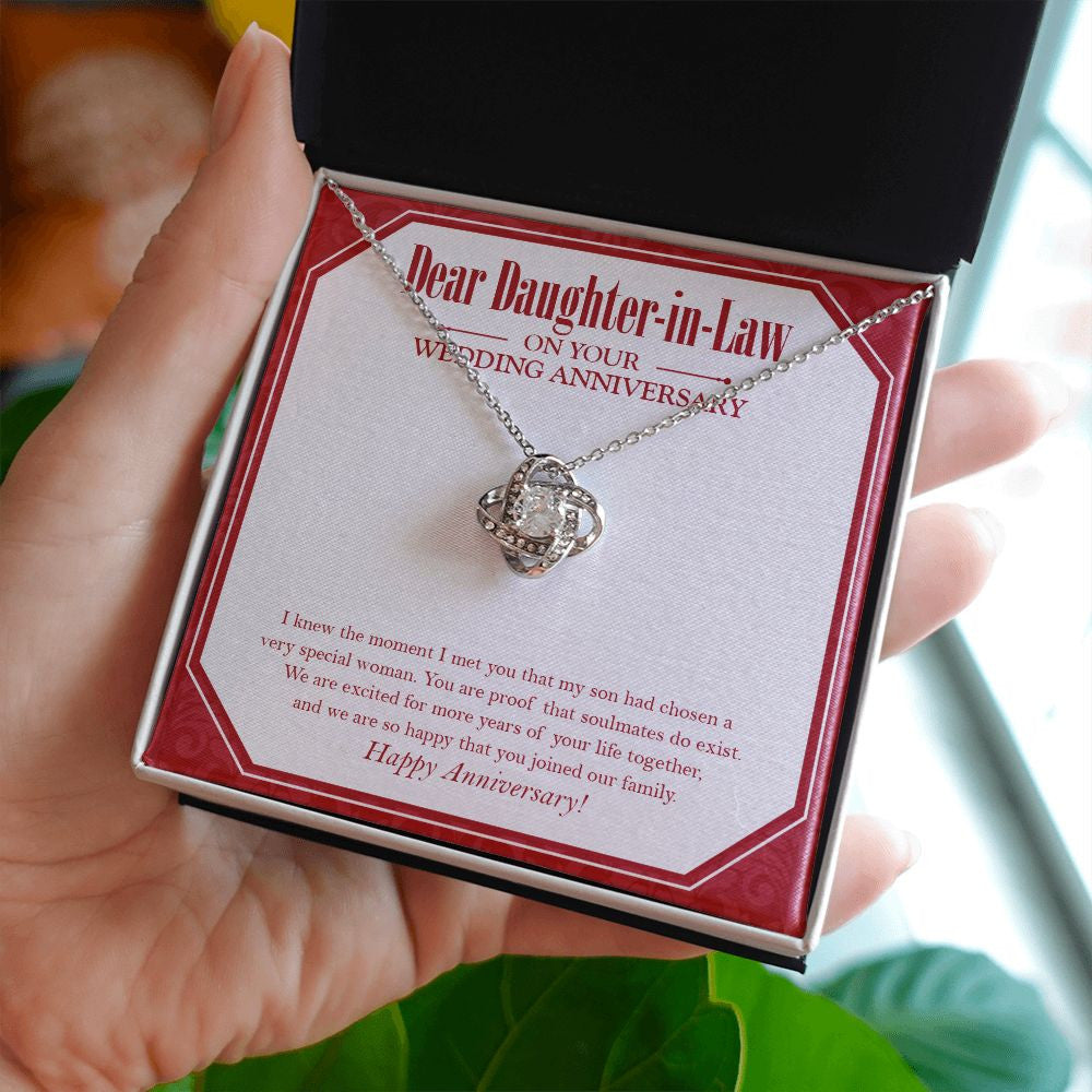 Your Life Together love knot necklace in hand