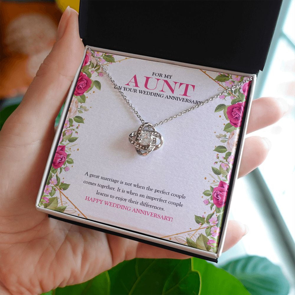 Marriage of Imperfect Couple love knot necklace in hand