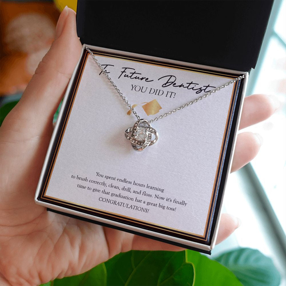 Great Big Toss love knot necklace in hand