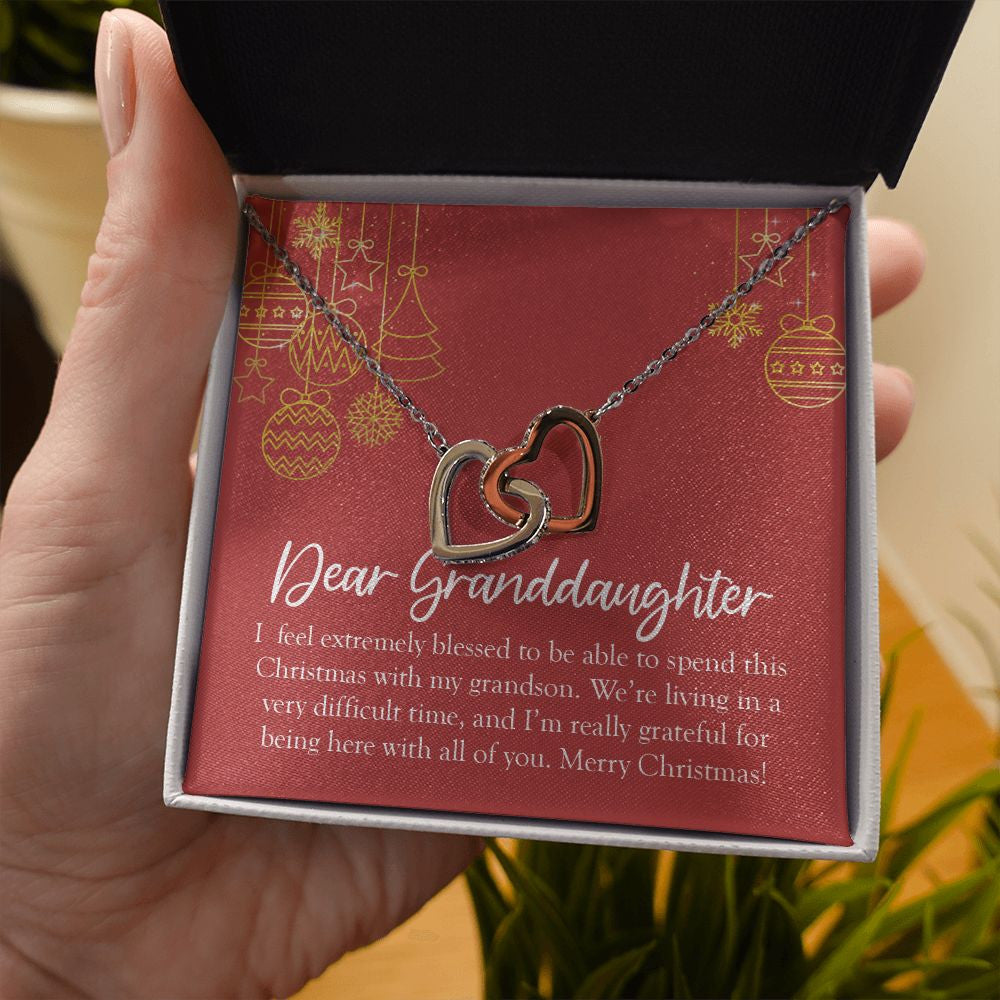 I Feel Extremely Blessed interlocking heart necklace in hand