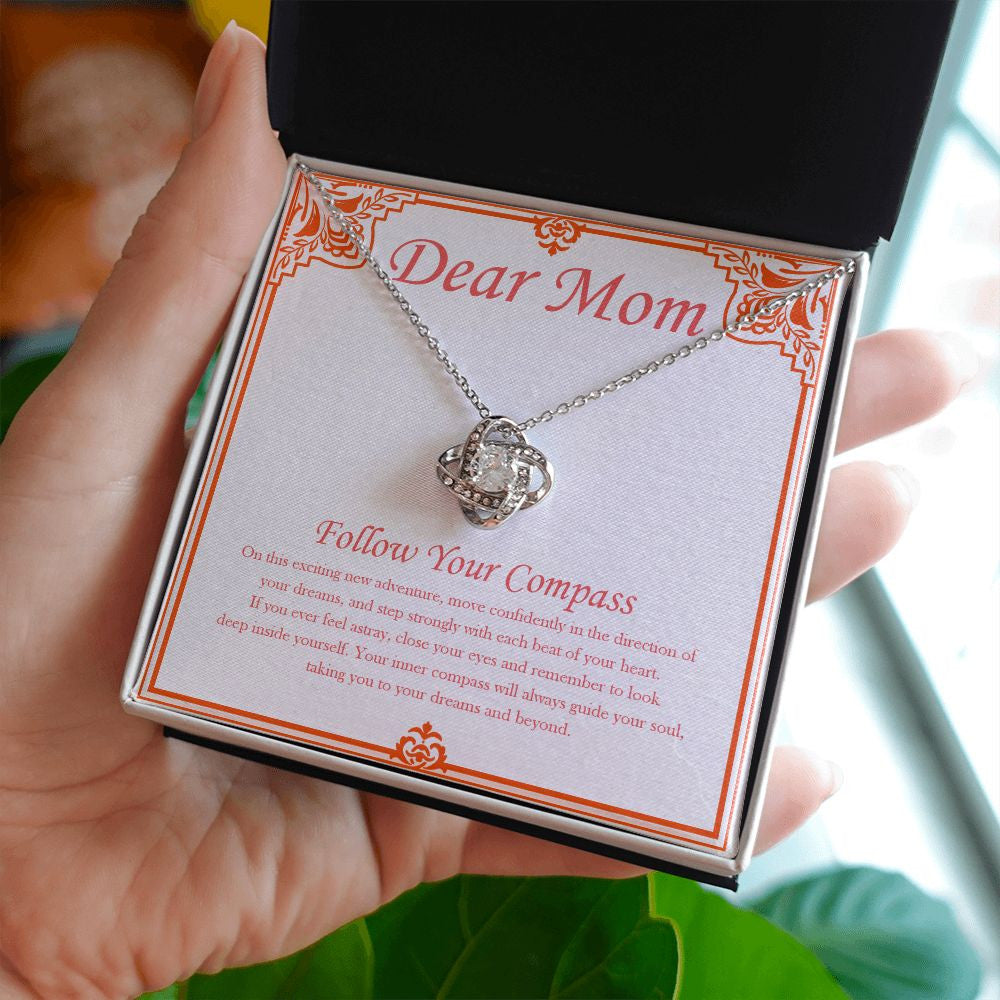 Deep Inside Yourself love knot necklace in hand