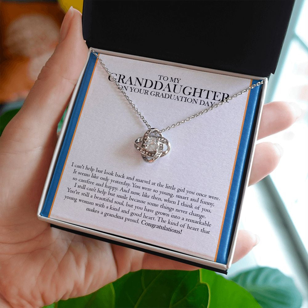 Look Back And Marvel love knot necklace in hand