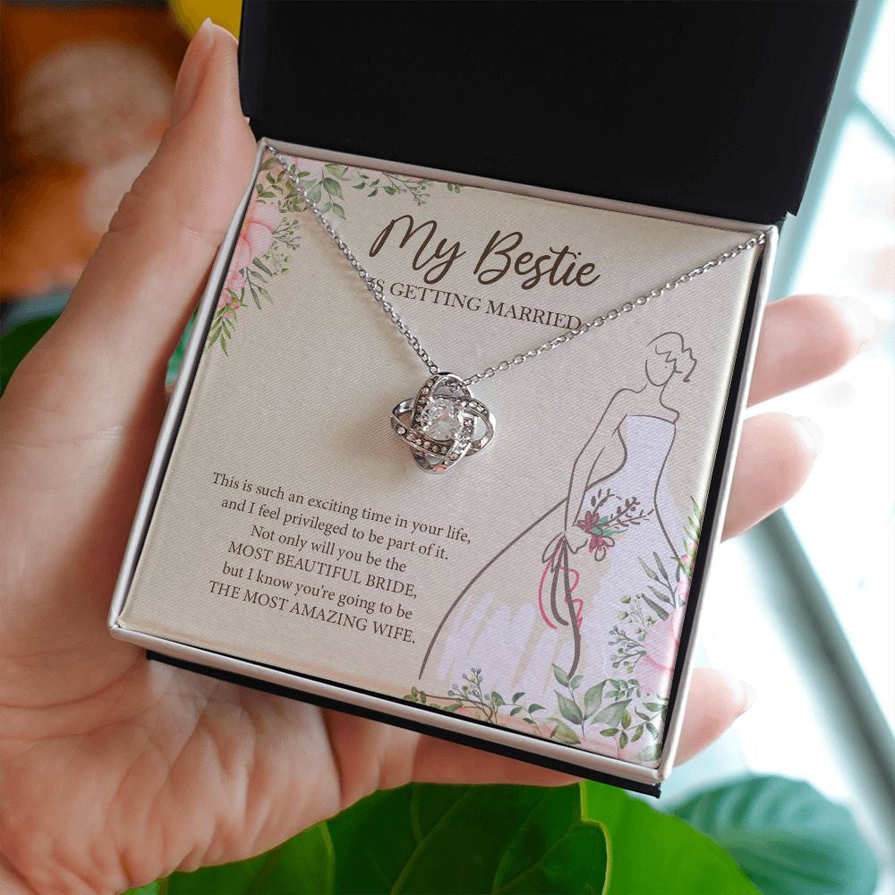 The Most Amazing Wife love knot necklace in hand