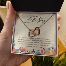 Load image into Gallery viewer, Lifelong friendship interlocking heart necklace in hand
