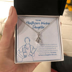 With Compassion And Care alluring beauty necklace in hand