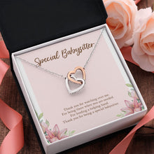 Load image into Gallery viewer, Lending A Helping Hand interlocking heart pendant pink flower
