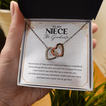 Load image into Gallery viewer, Start Your Adventure interlocking heart necklace in hand
