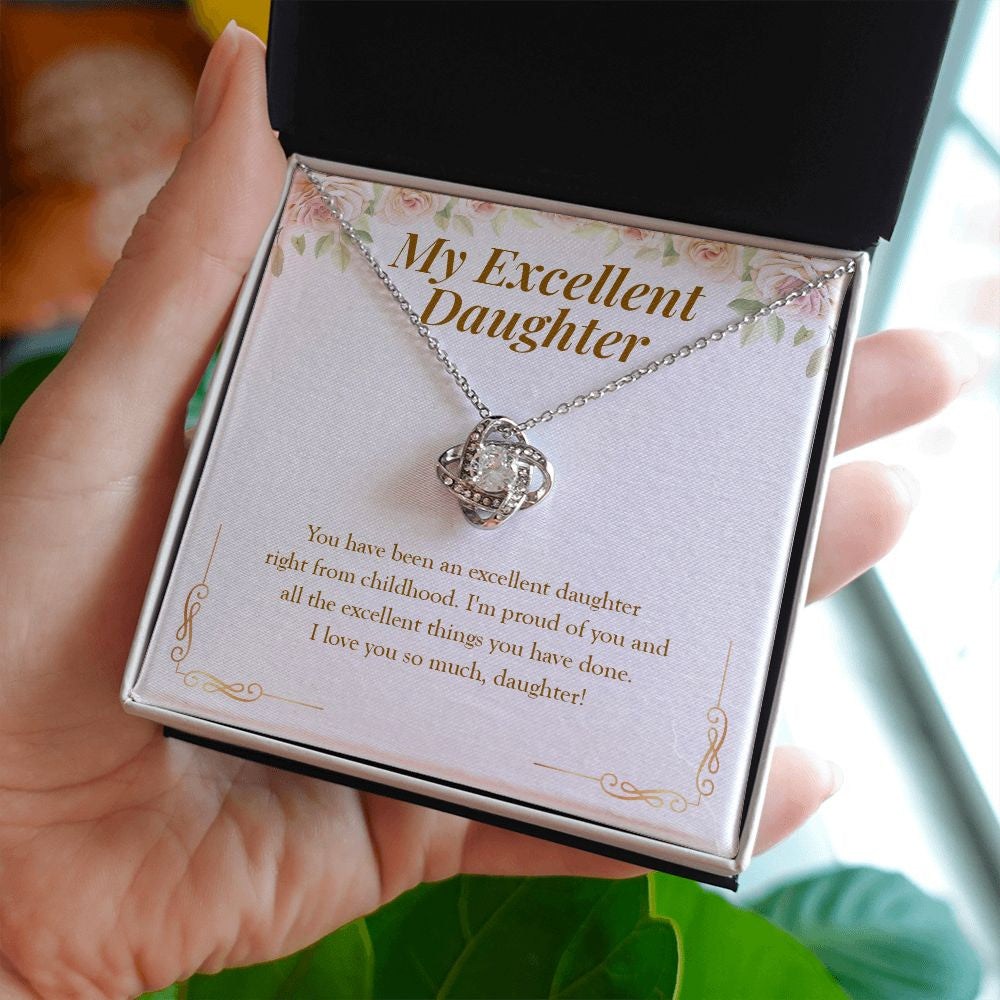 Right From Childhood love knot necklace in hand