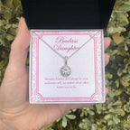 Remain Fearless And Authentic eternal hope necklace in hand