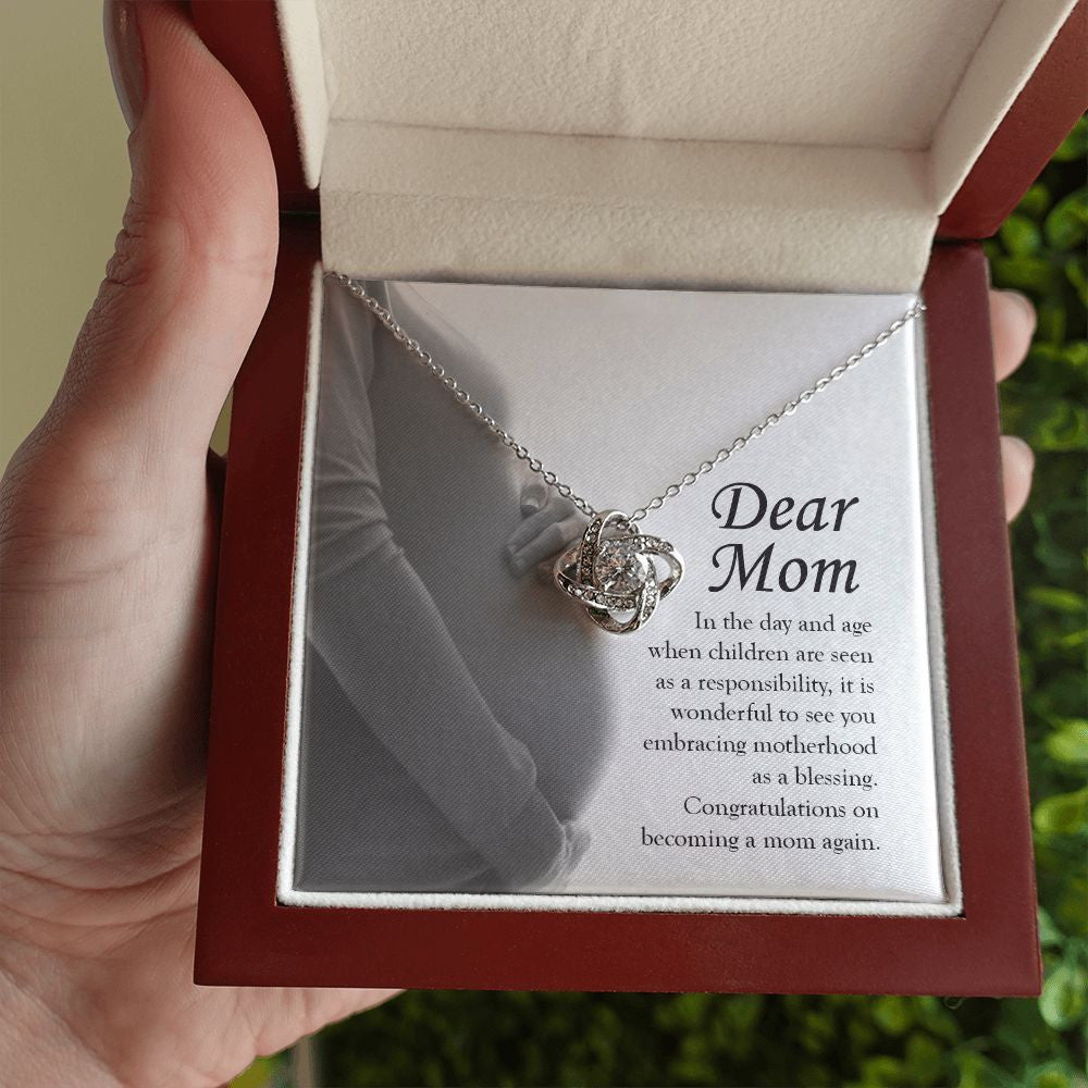 Embracing Motherhood Again love knot necklace luxury led box hand holding
