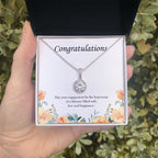 Beginning Of A Lifetime eternal hope necklace in hand