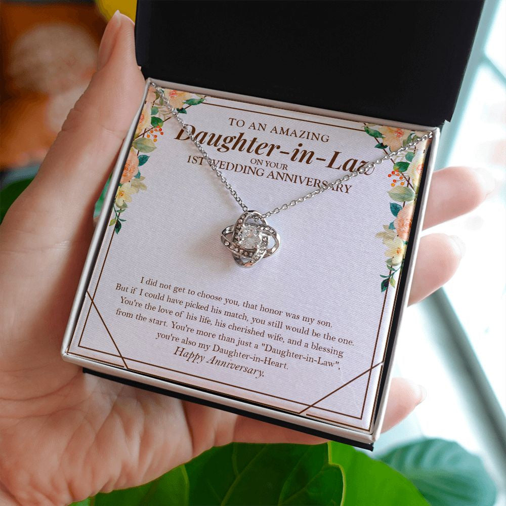I Didn't Choose You love knot necklace in hand