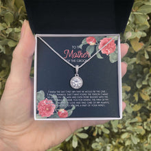 Load image into Gallery viewer, Raising The Man Of My Dreams eternal hope necklace in hand
