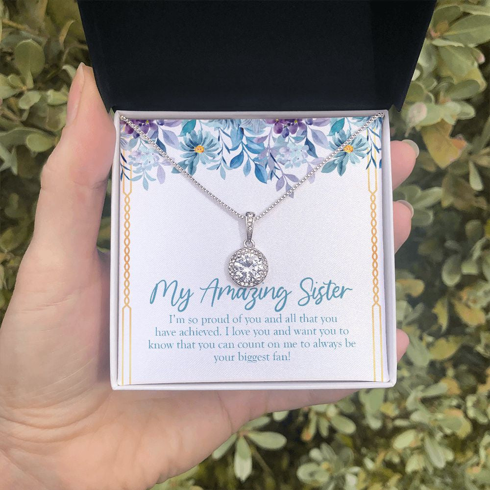 Your Biggest Fan eternal hope necklace in hand