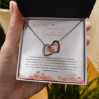 Work Hard And Never Give Up interlocking heart necklace in hand