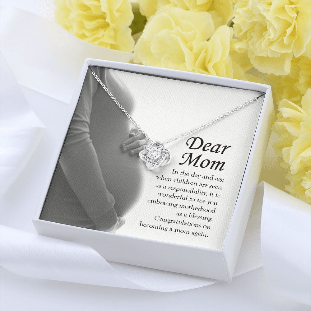 Embracing Motherhood Again love knot pendant yellow flower