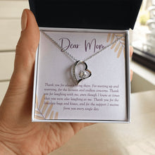 Load image into Gallery viewer, Lectures and Concerns forever love silver necklace in hand
