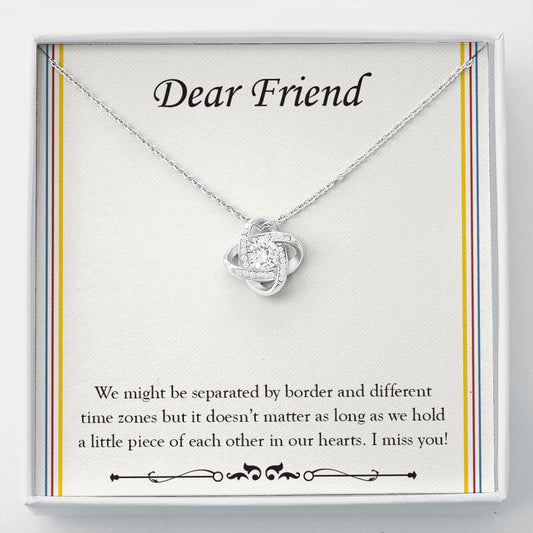 Separated By Border And Time Zone love knot necklace front