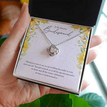 Load image into Gallery viewer, Special Memories love knot necklace in hand
