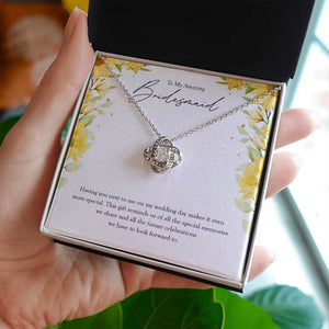 Special Memories love knot necklace in hand
