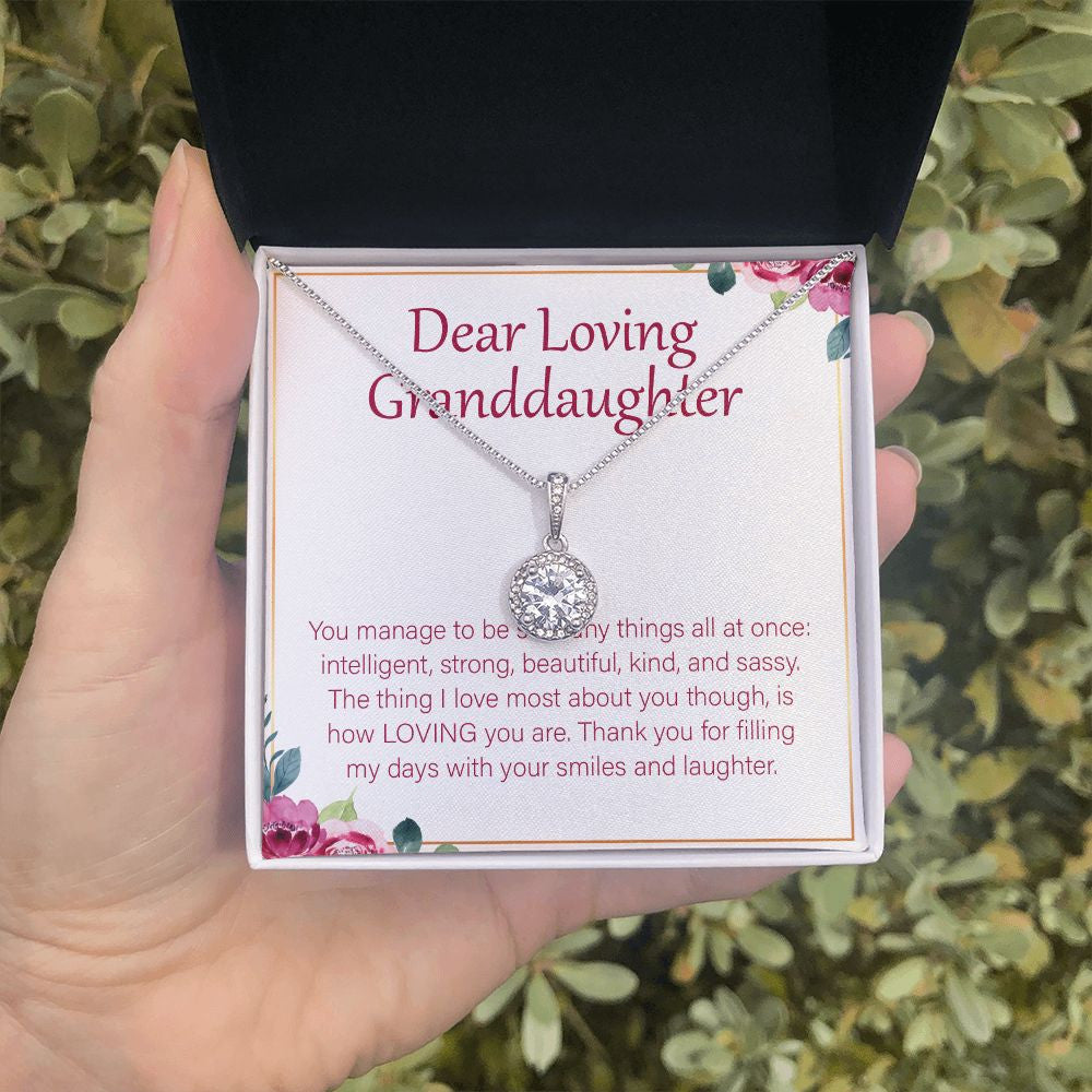 With Your Smiles And Laughter eternal hope necklace in hand