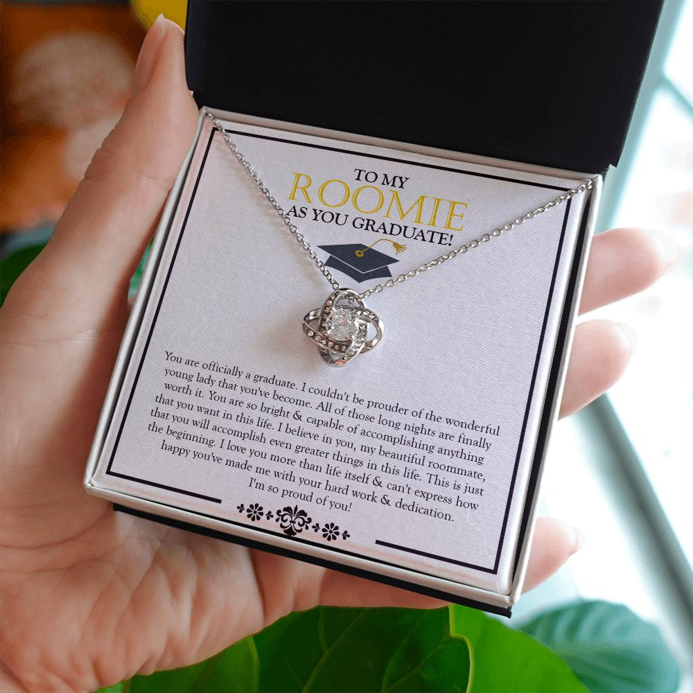 I Believe In You love knot necklace in hand