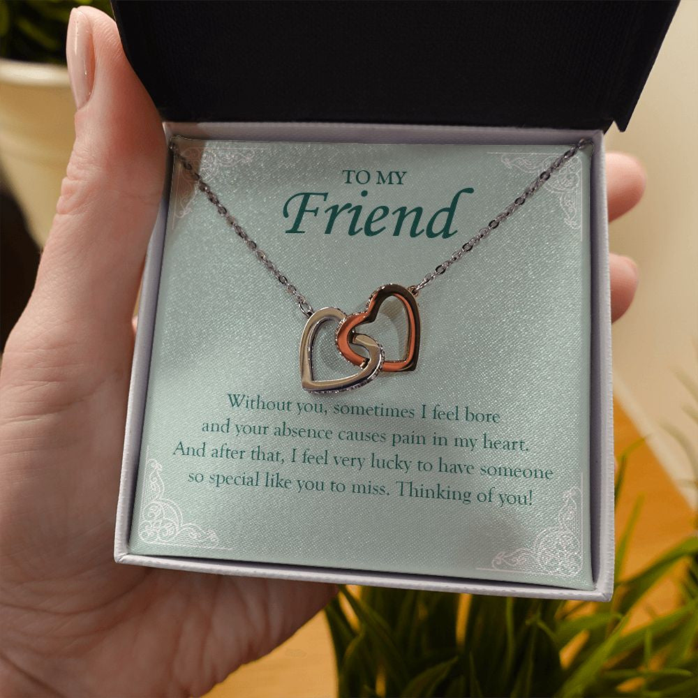 Someone Special Like You interlocking heart necklace in hand