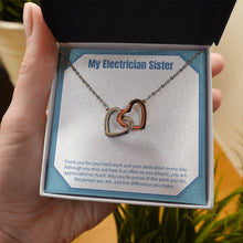 Load image into Gallery viewer, Be Proud Of Your Work interlocking heart necklace in hand

