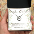 Love That Sets To Last horseshoe necklace in hand